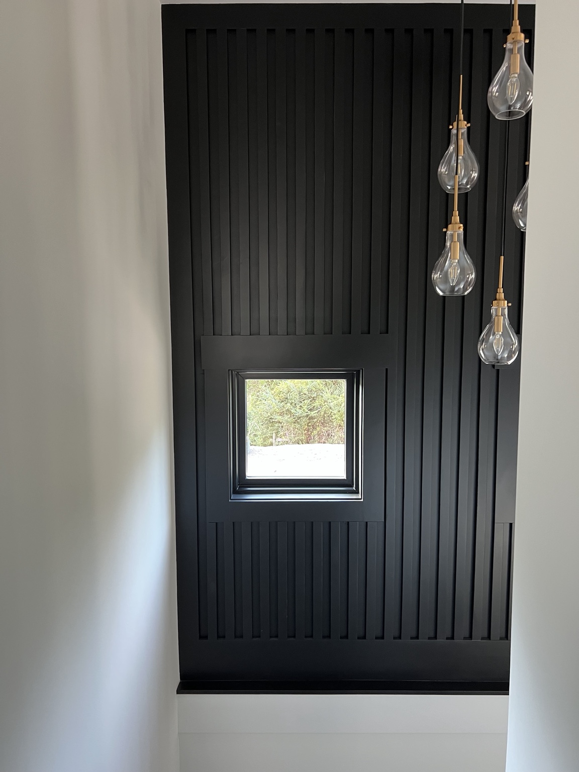 Black accent wall and interior architectural detail
