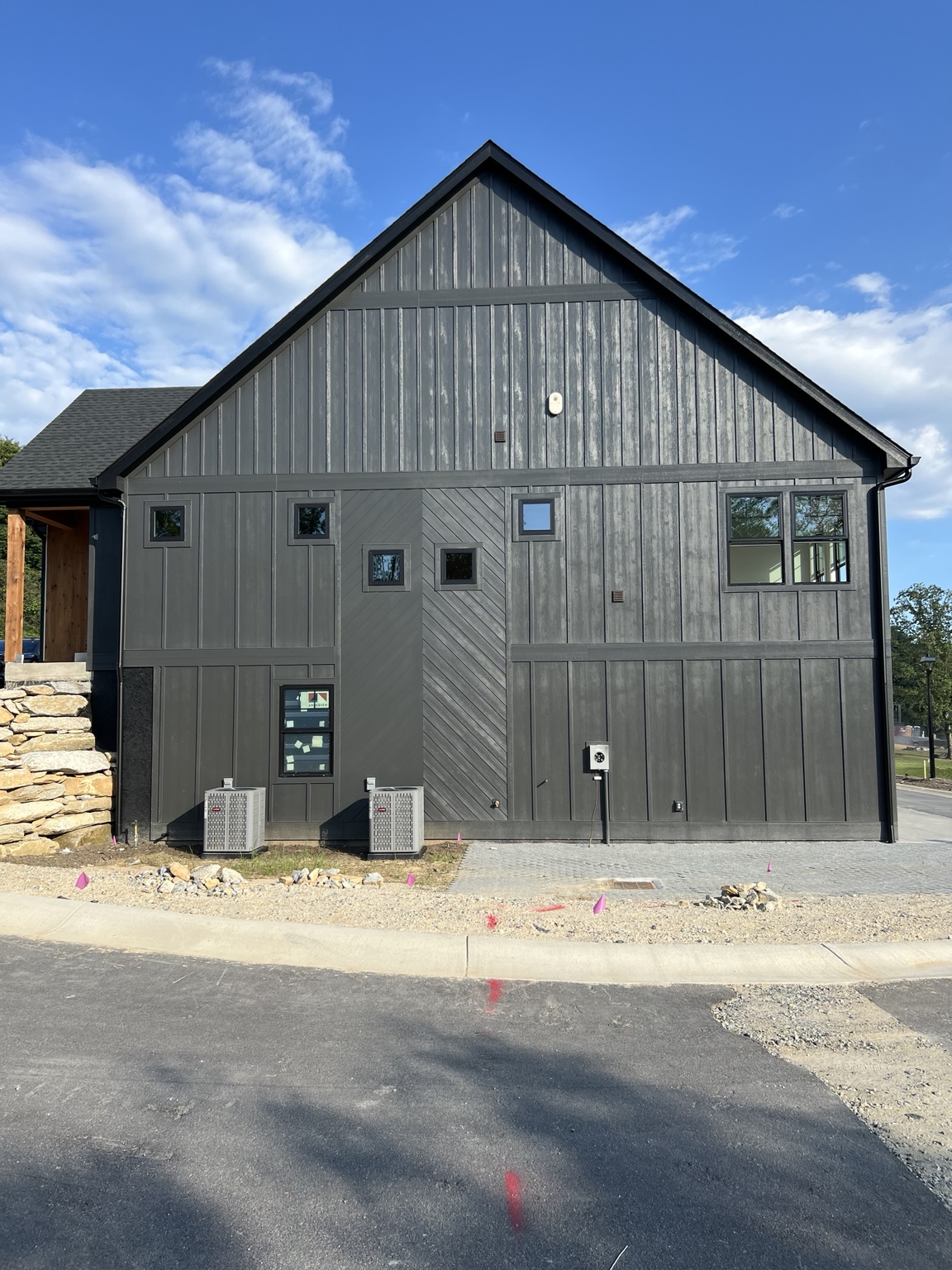 Rear elevation of the dark exterior during ongoing residential construction